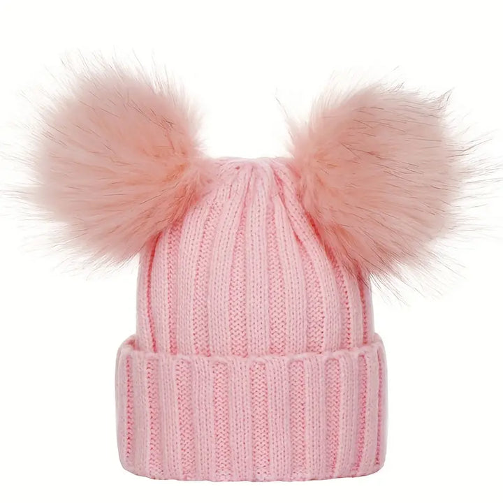 Ladies winter hat with pompoms