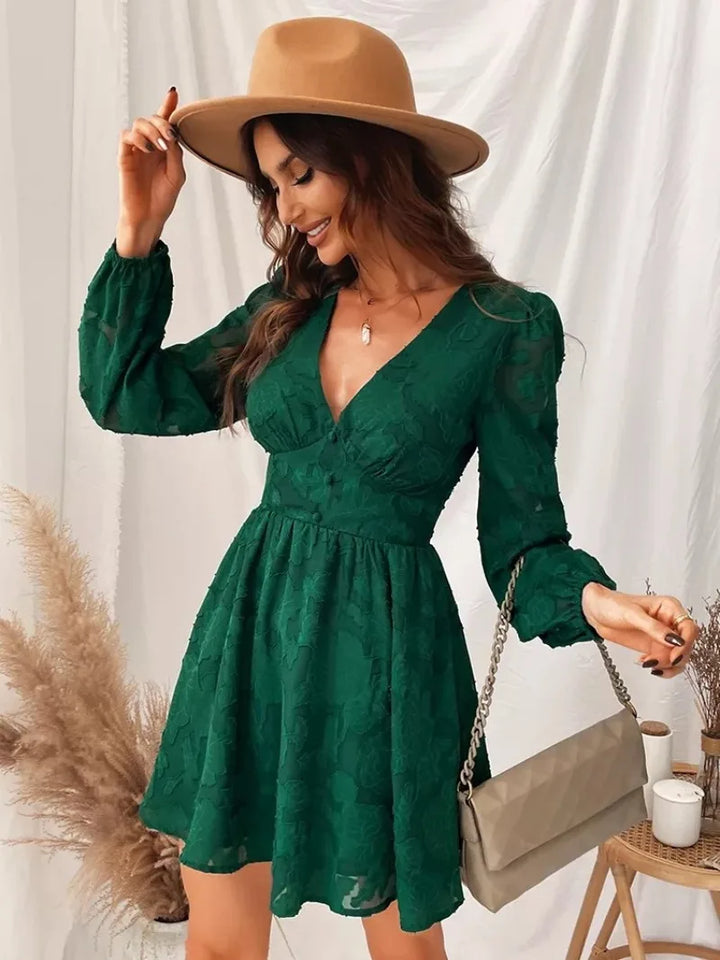 Vintage green lace dress with long sleeves and a deep V-neckline