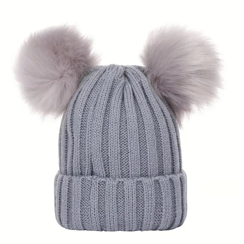 Ladies winter hat with pompoms