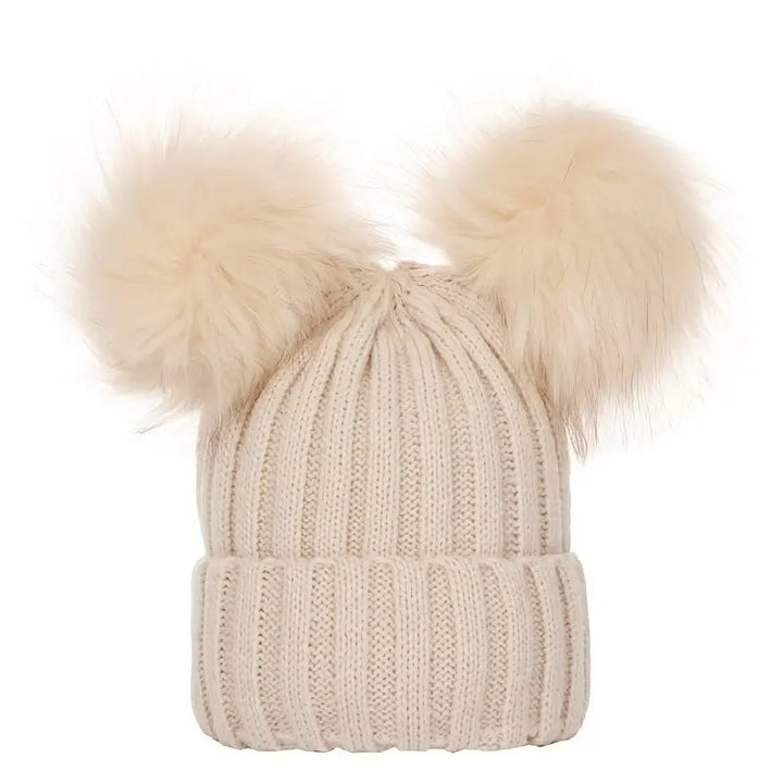 Ladies winter hat with pompoms